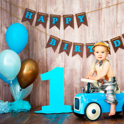 Little Boy Is Sitting On Car Celebrating 1st Birthday